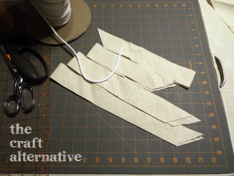 Make a Pillow with a Needlepoint Piece cutting bias strips