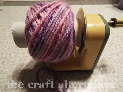 Make a Yarn Holder with a Toilet Paper Stand nicely would yarn ball