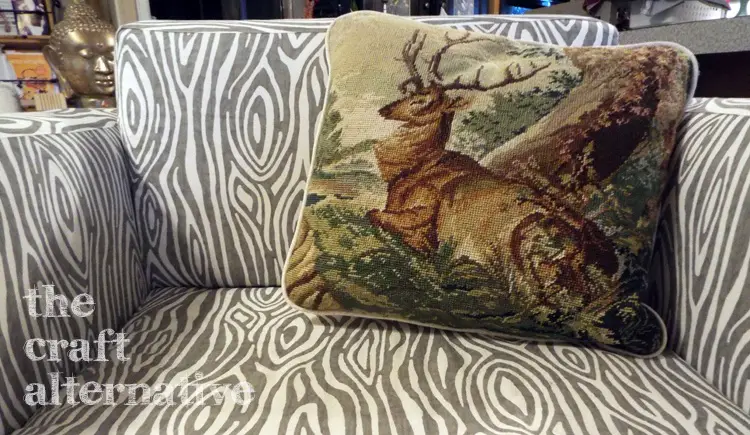 Make a Pillow with a Needlepoint Piece pillow on chair
