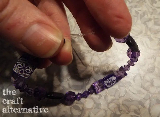 how to tie a knot in stretch cord pull cord and tail at the same time