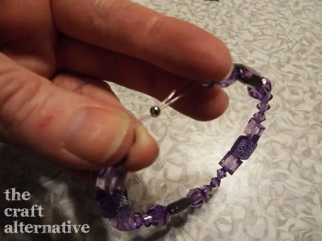 how to tie a knot in stretch cord cover knot with crimp bead